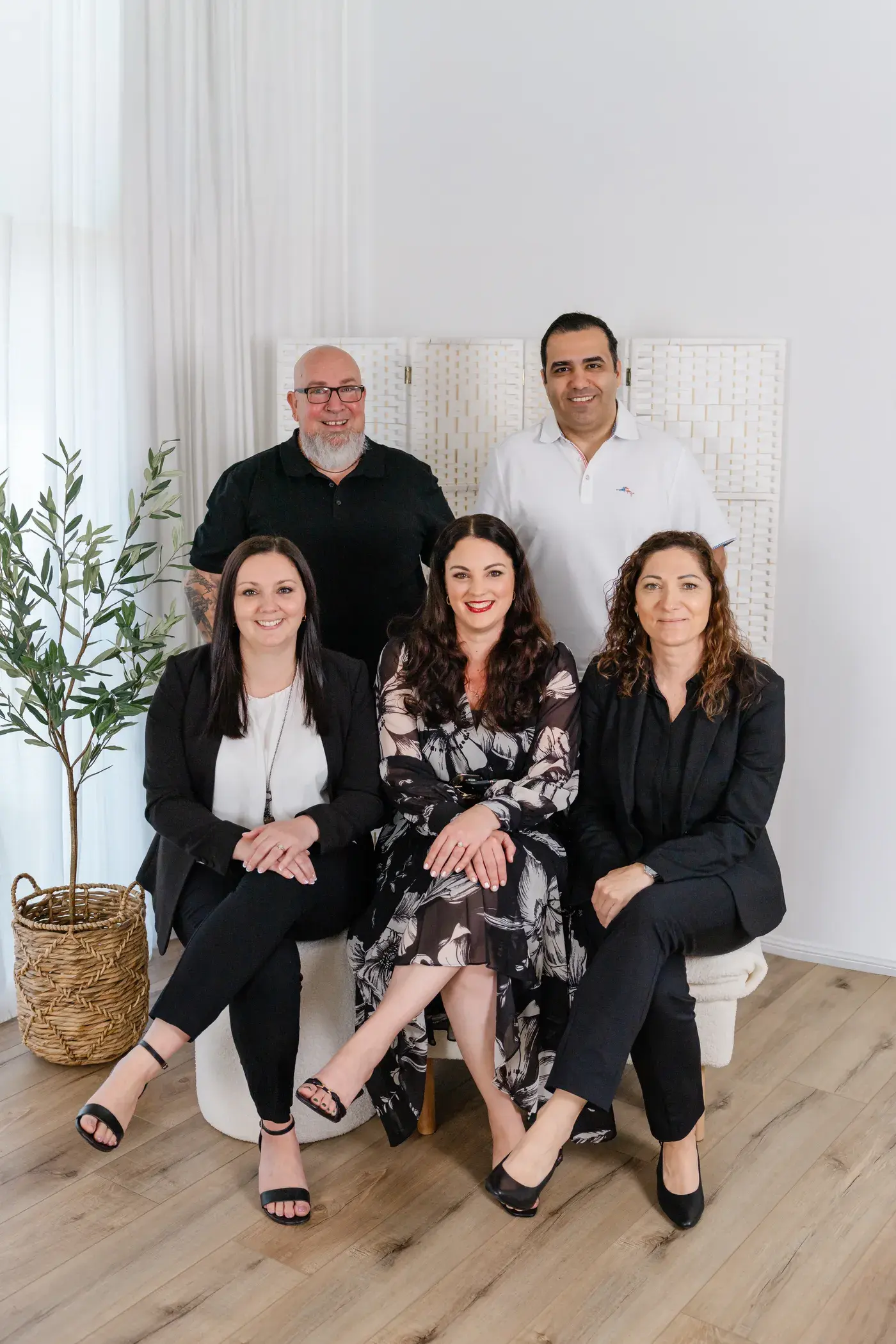 Jase and Kasra standing behind Ally, Shelley and Lenka, seated together in the studio